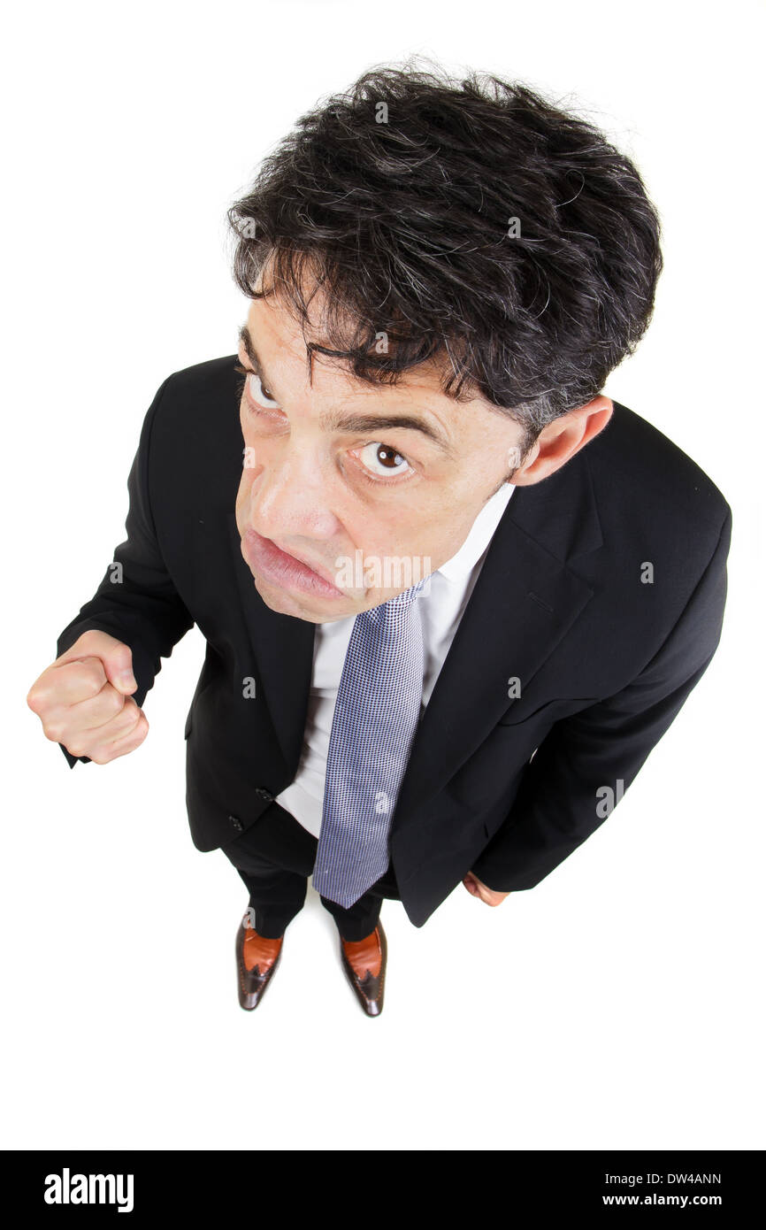 High angle humoristique full length portrait d'un homme en colère et faisant un poing, isolated on white Banque D'Images