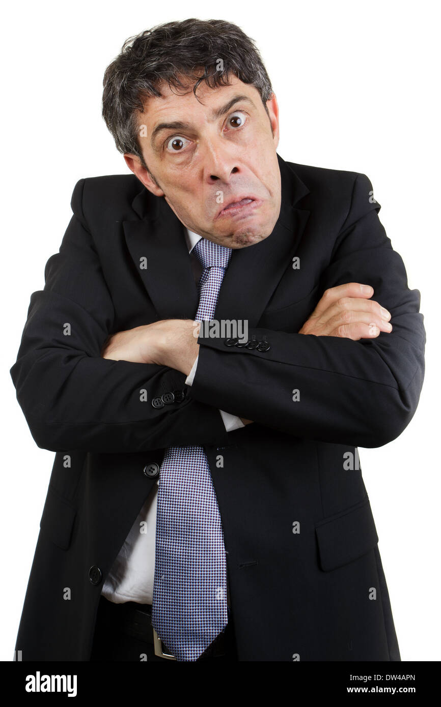 Homme d'affaires est l'extraction d'un visage avec les bras croisés Banque D'Images