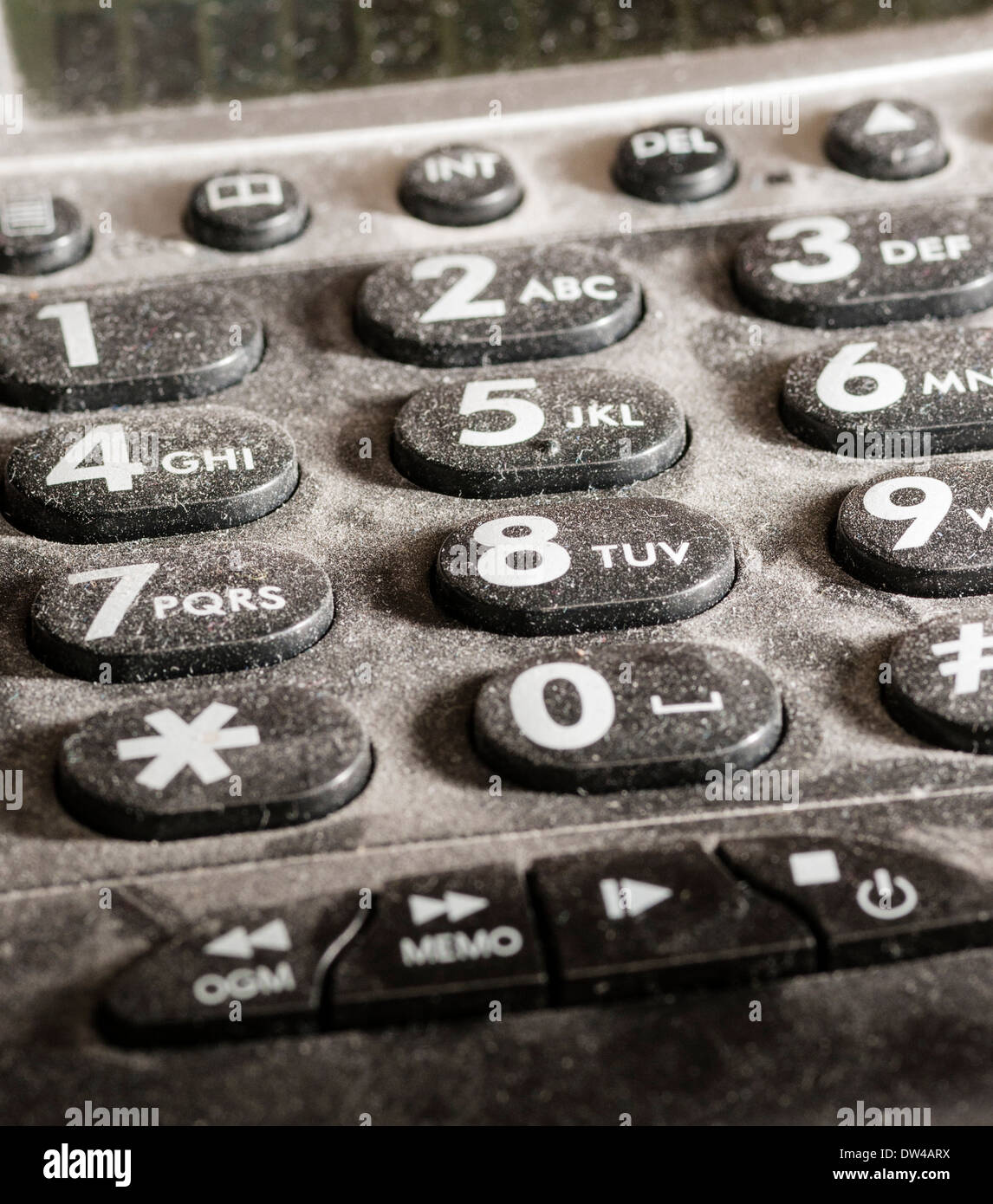 Close up of dusty clavier téléphonique, uniformément éclairé. Banque D'Images