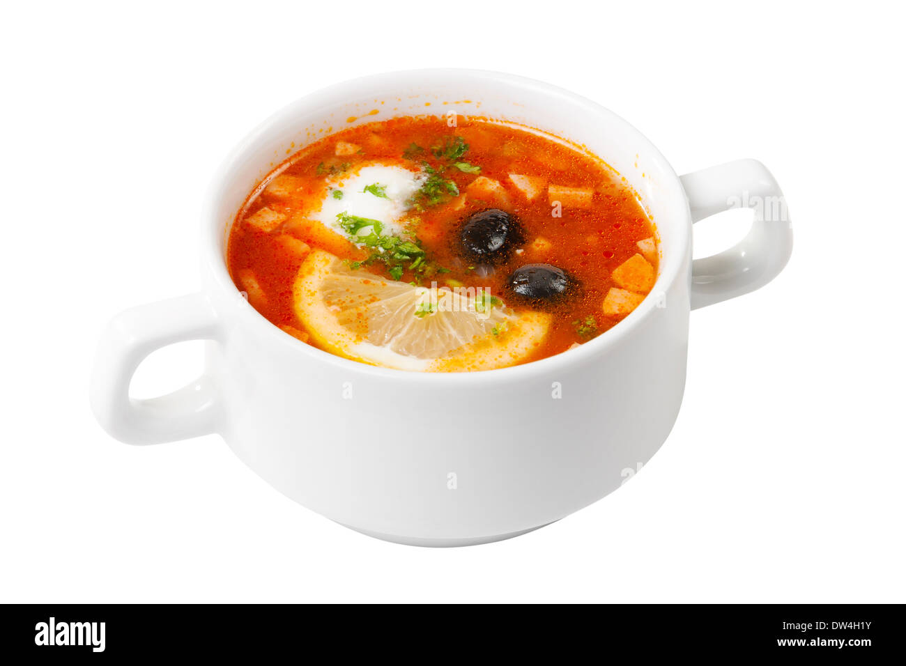 Soupe avec la viande et les légumes dans un bol blanc Banque D'Images