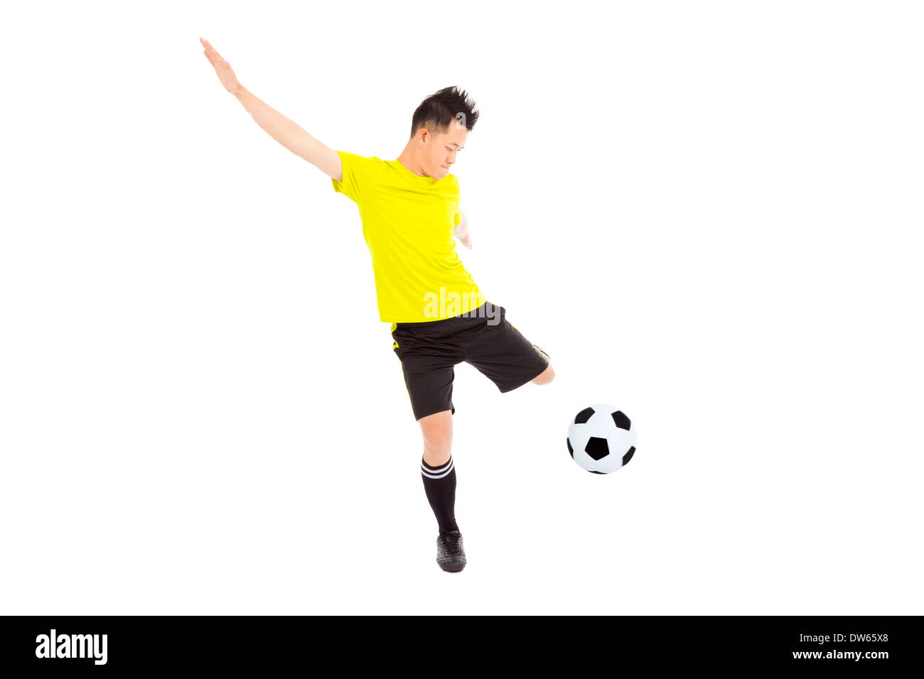 Football soccer player kicking ball jeune homme Banque D'Images