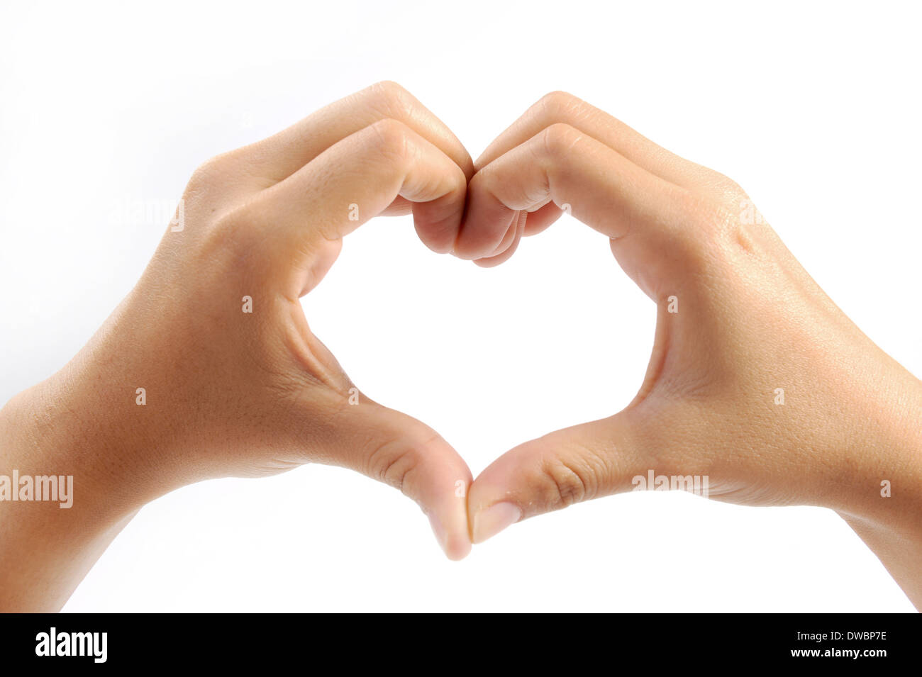Les mains dans la forme de cœur isolé sur fond blanc Banque D'Images