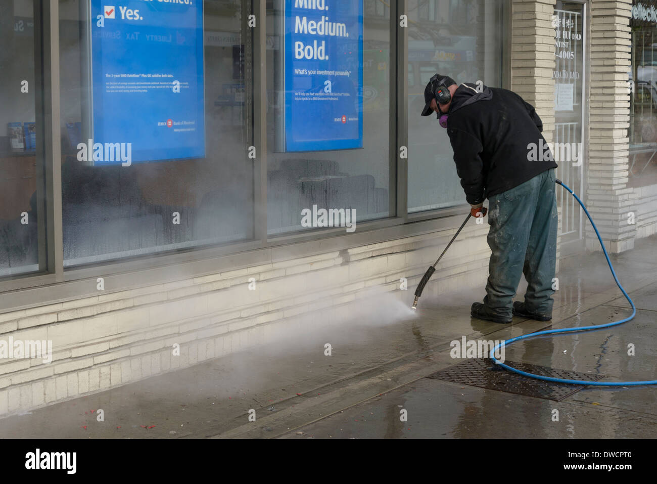 La puissance de l'homme lave-trottoir Banque D'Images
