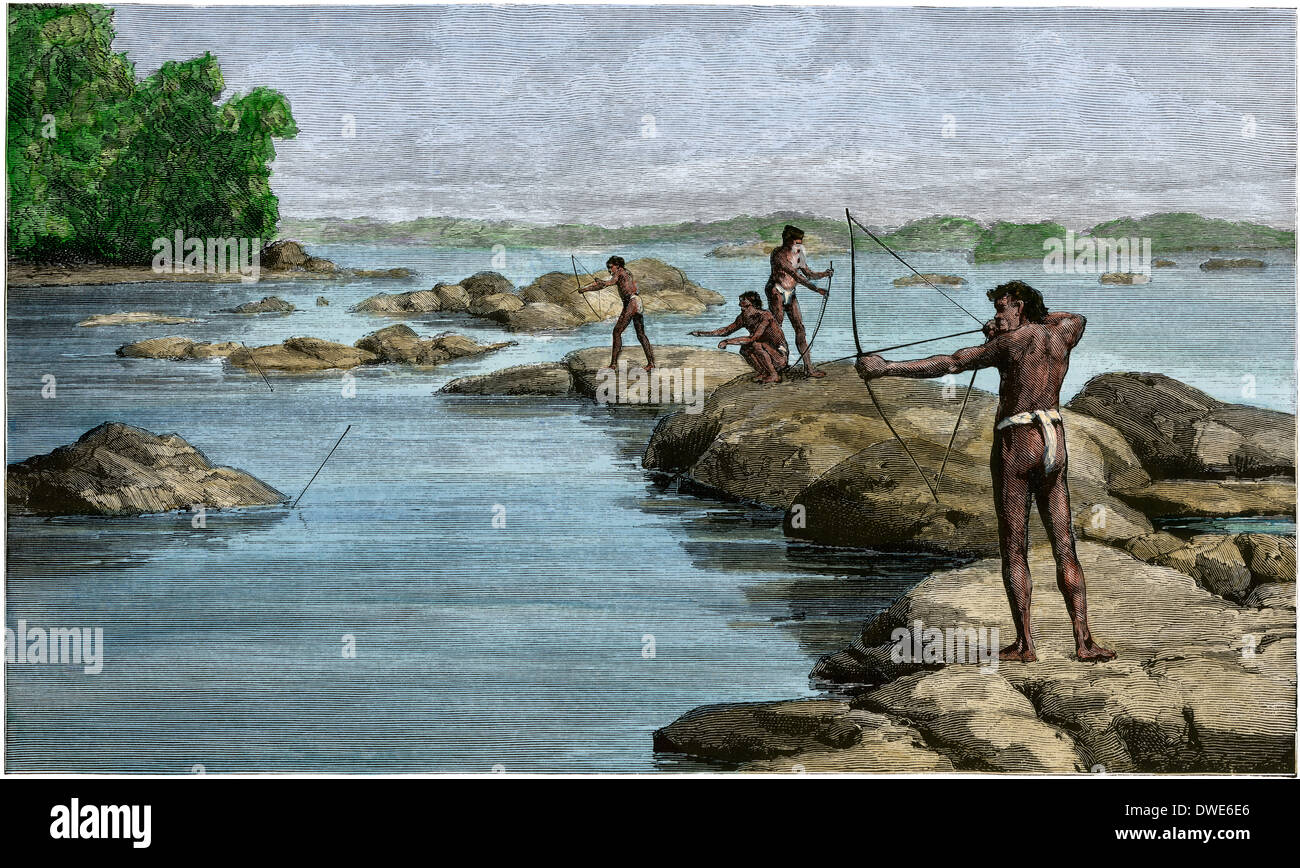 Les autochtones de la Guyane britannique sting tir-rayons sur la rivière Berbice, 1880. À la main, gravure sur bois Banque D'Images