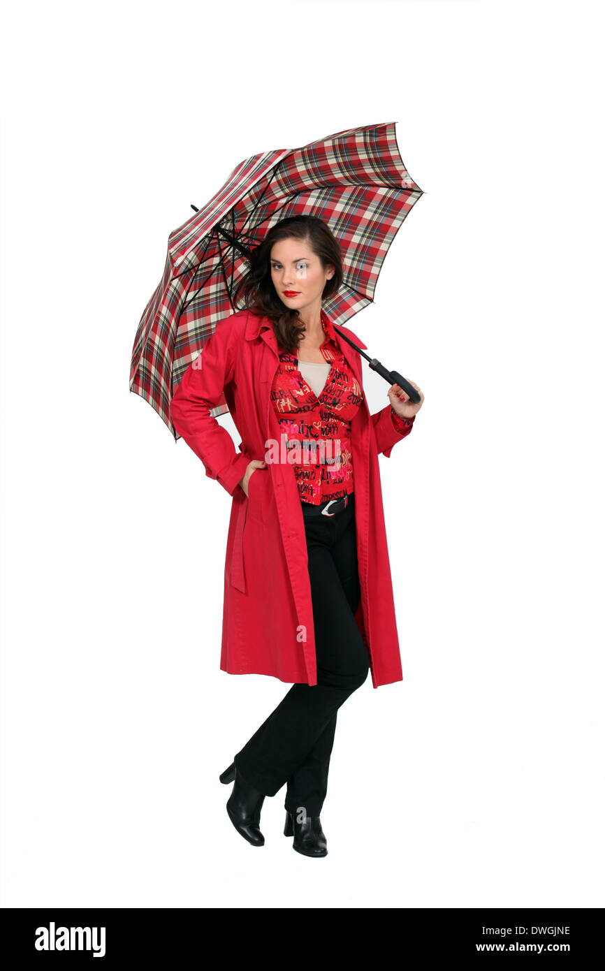 Un mode femme tenant un parapluie Banque D'Images