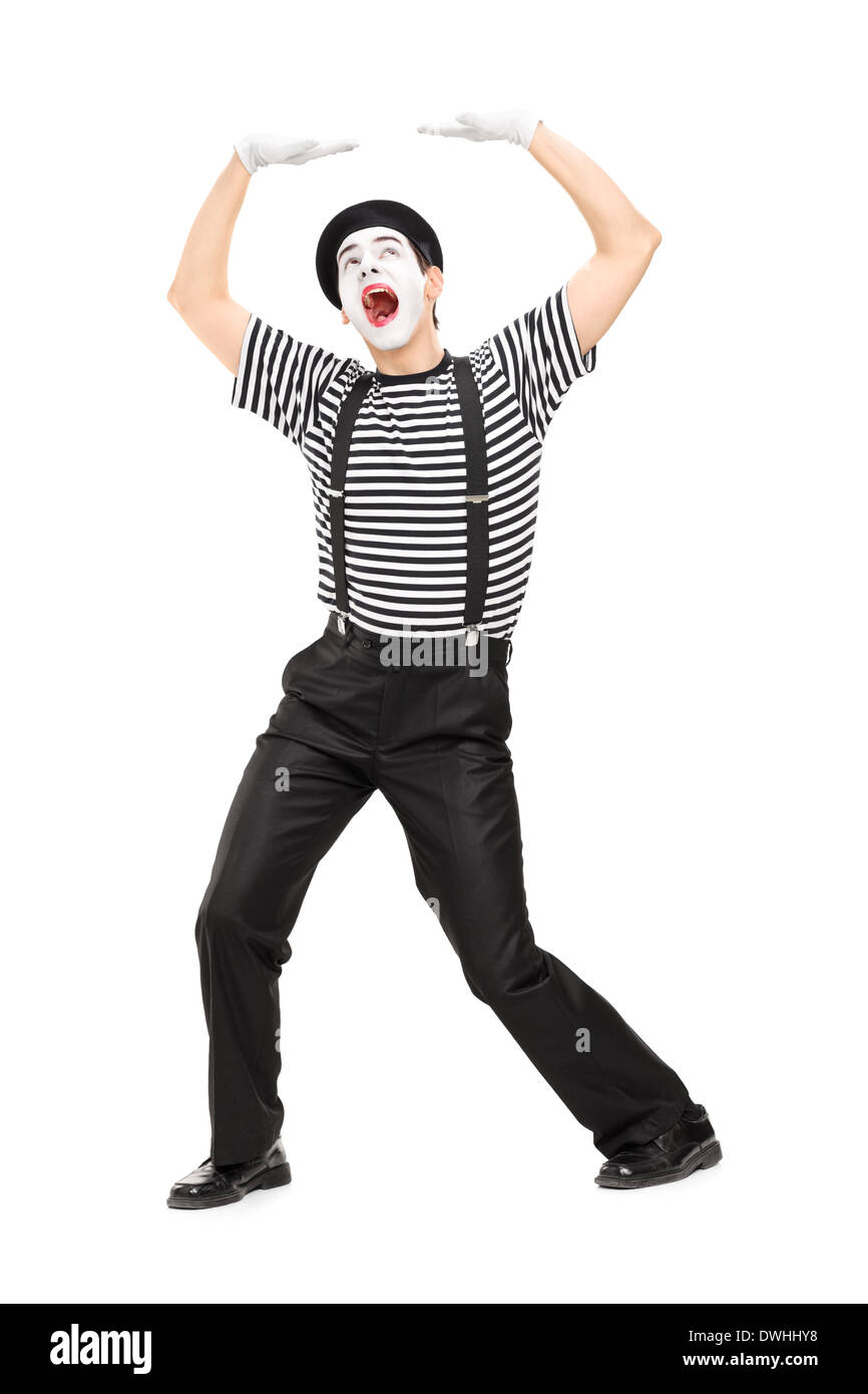 Artiste Mime simuler déposer quelque chose sur la tête Banque D'Images