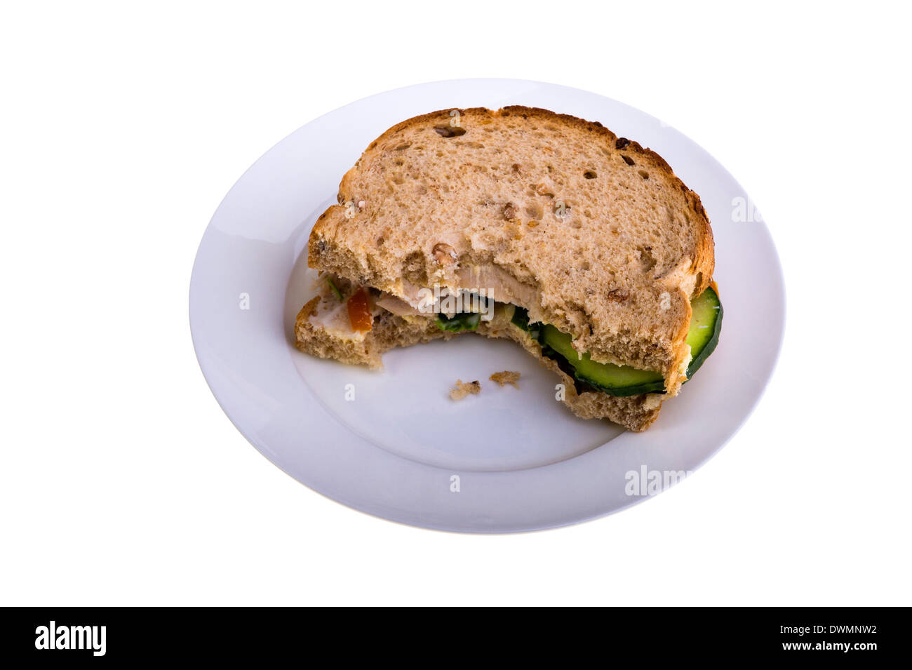 Grenier à pain sandwich au poulet, sur une assiette blanche. Banque D'Images