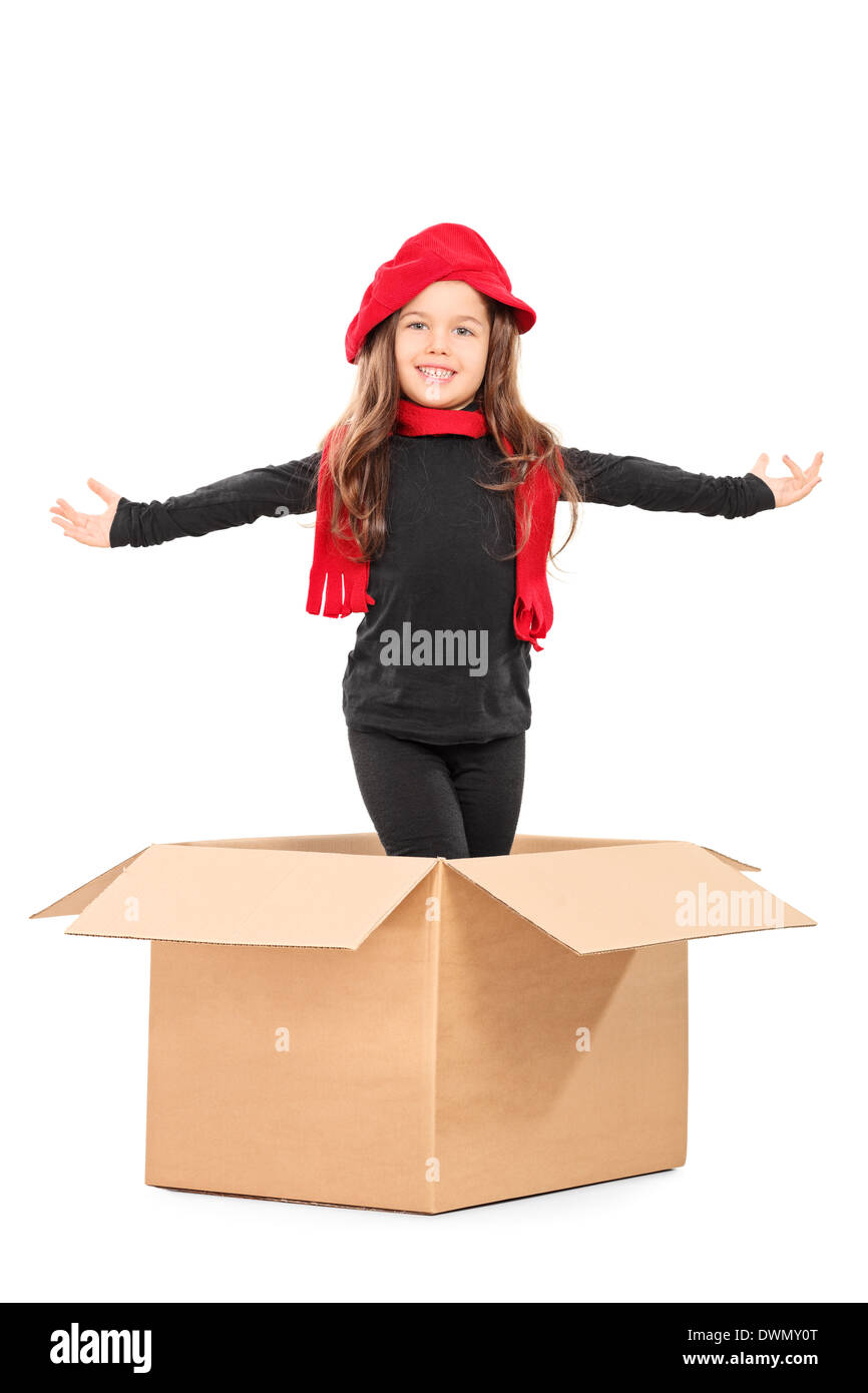 Playful Girl standing in a box Banque D'Images