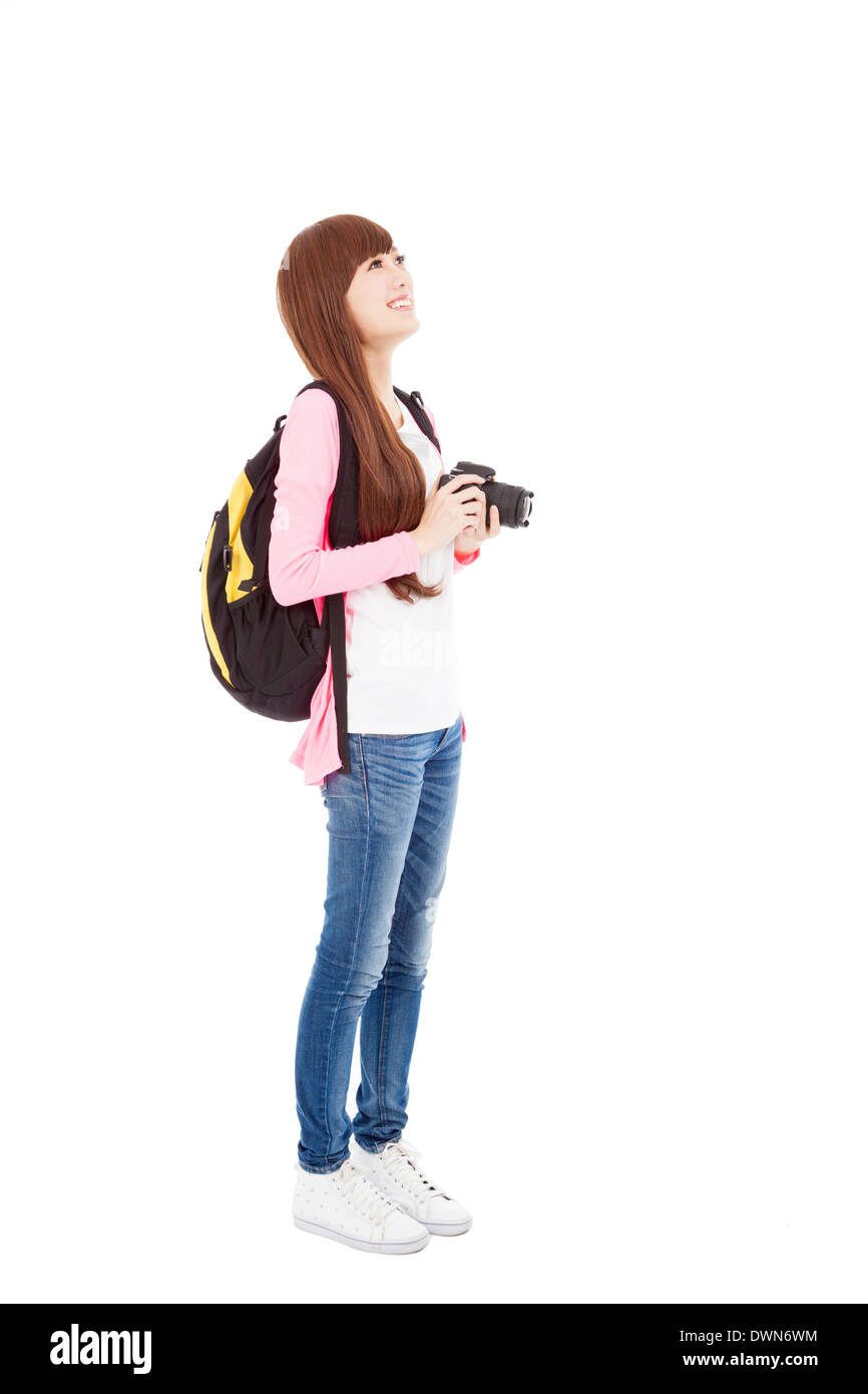 Jeune fille sur toute la longueur de la prise d'une photo à l'aide de l'appareil photo numérique.isolated on white Banque D'Images