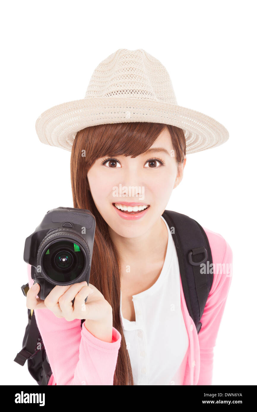 Sourire et belle jeune femme tenant un appareil photo numérique. Banque D'Images