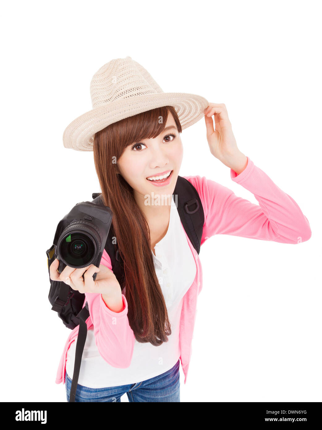 Smiling young woman holding a camera et hat.isolated on white Banque D'Images