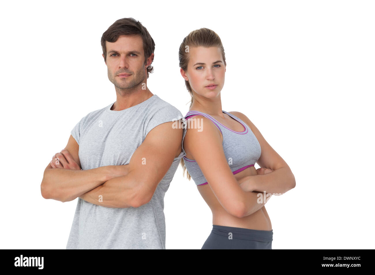 Portrait d'un couple sportif avec les bras croisés Banque D'Images