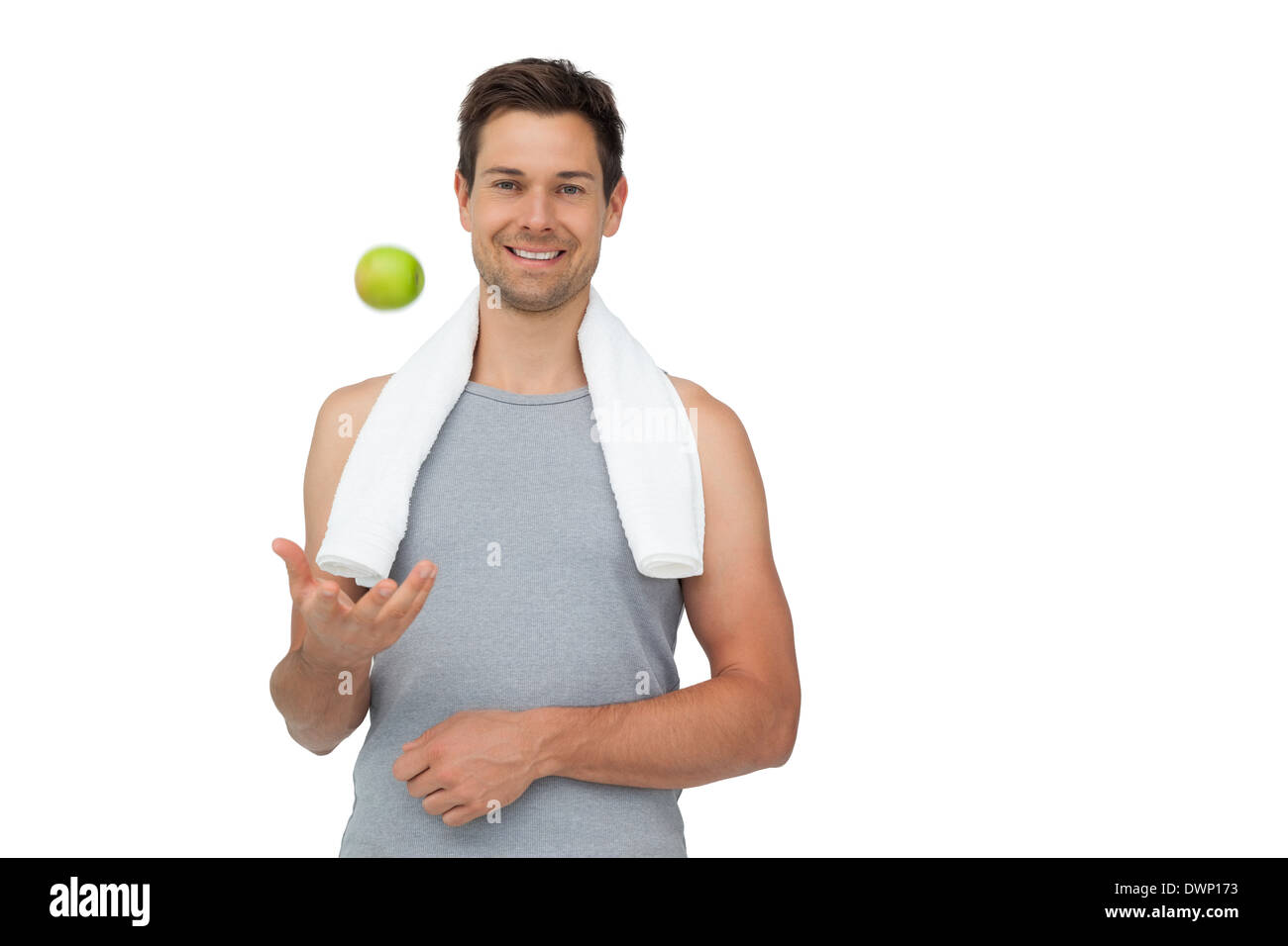 Portrait of a smiling fit young man avec Apple Banque D'Images