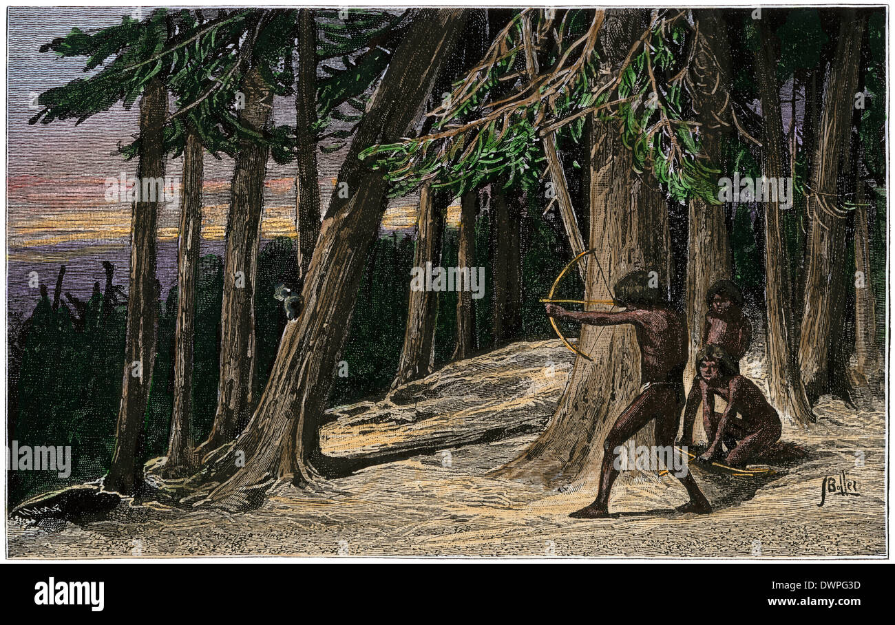 Native American boy practicing archery dans une forêt précolombienne. À la main, gravure sur bois Banque D'Images