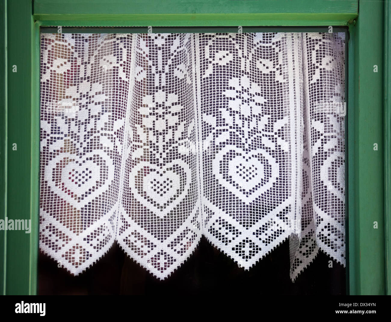 Rideau de dentelle avec un coeur, symbole de l'amour Banque D'Images