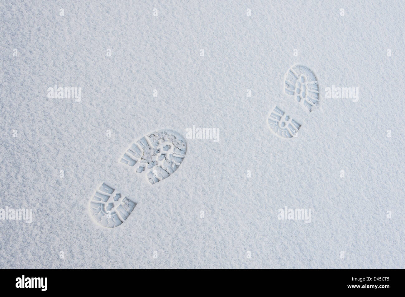 Footprints in snow Banque D'Images