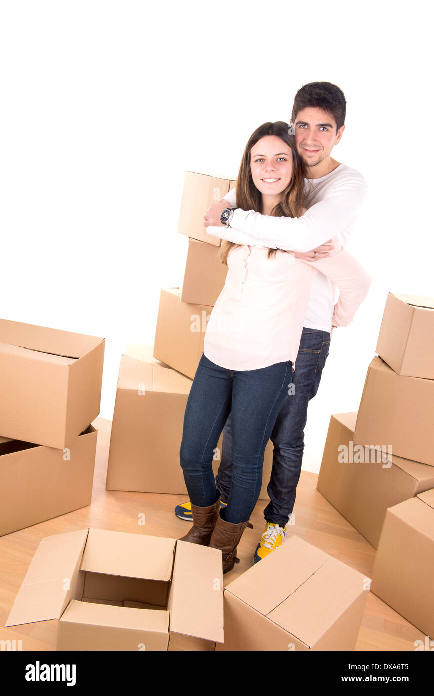 Couple heureux avec boxes moving into new home vacances Banque D'Images