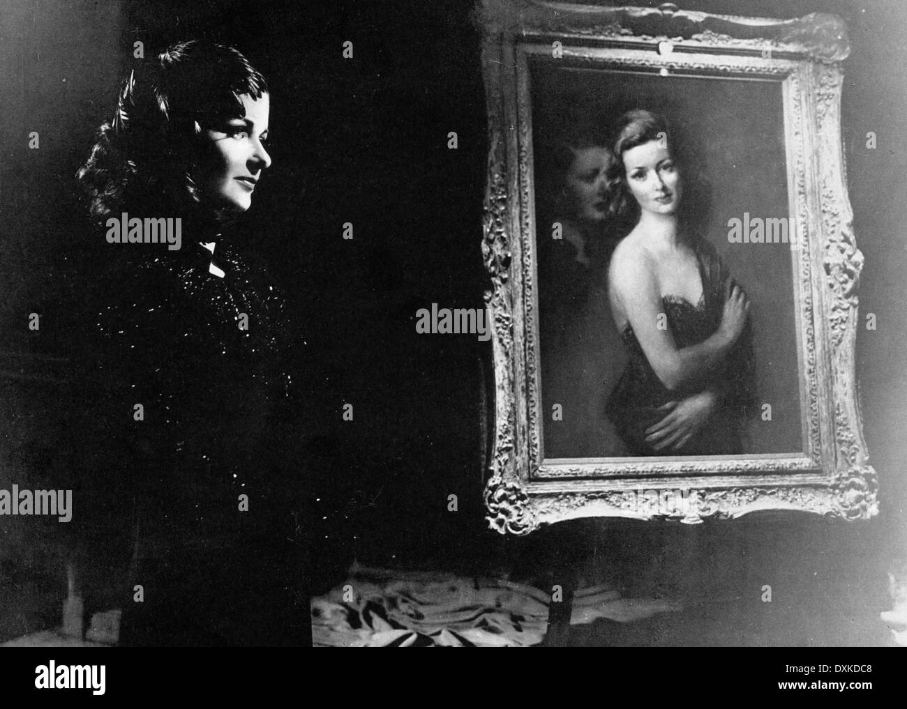 La femme DANS LA FENÊTRE Banque D'Images