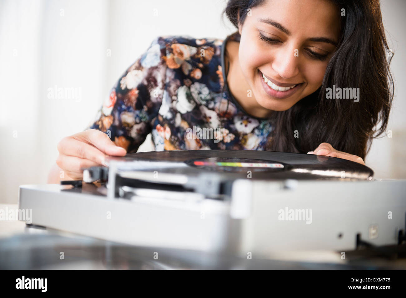 Close up of Asian woman using record player Banque D'Images