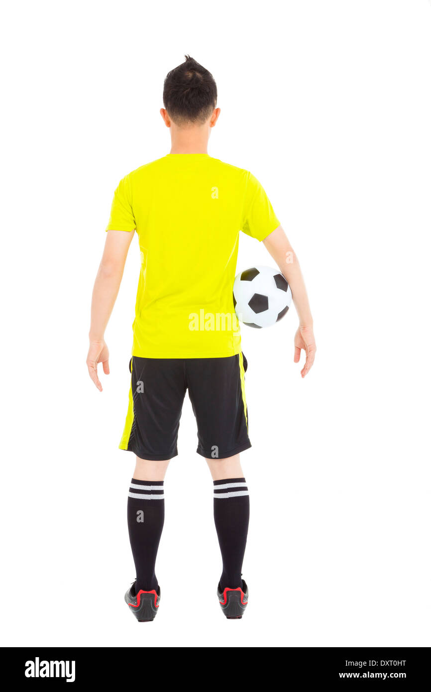 Joueur de foot en tenant une soccer en studio Banque D'Images