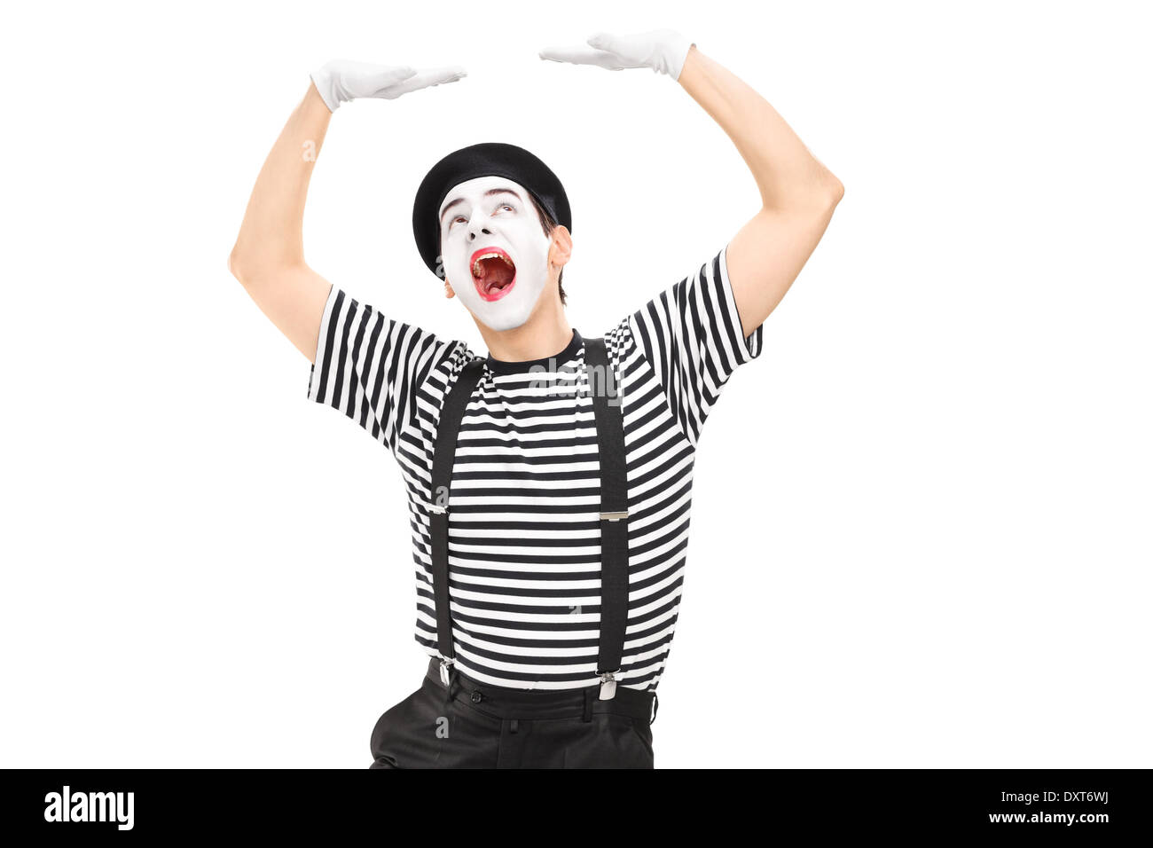 Artiste Mime simuler déposer quelque chose sur la tête Banque D'Images