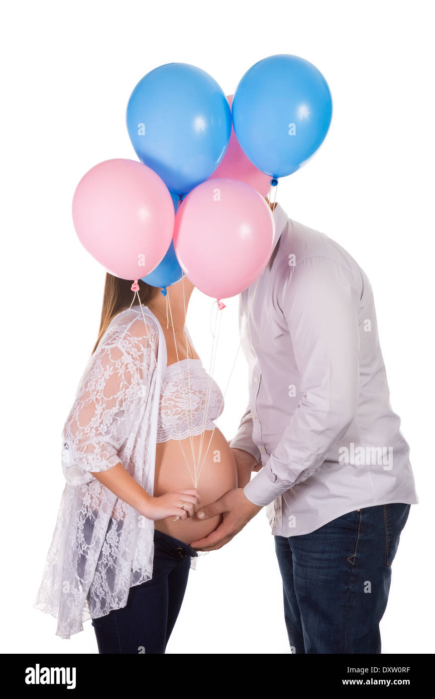 Happy pregnant woman holding balloons pour leur bébé Banque D'Images