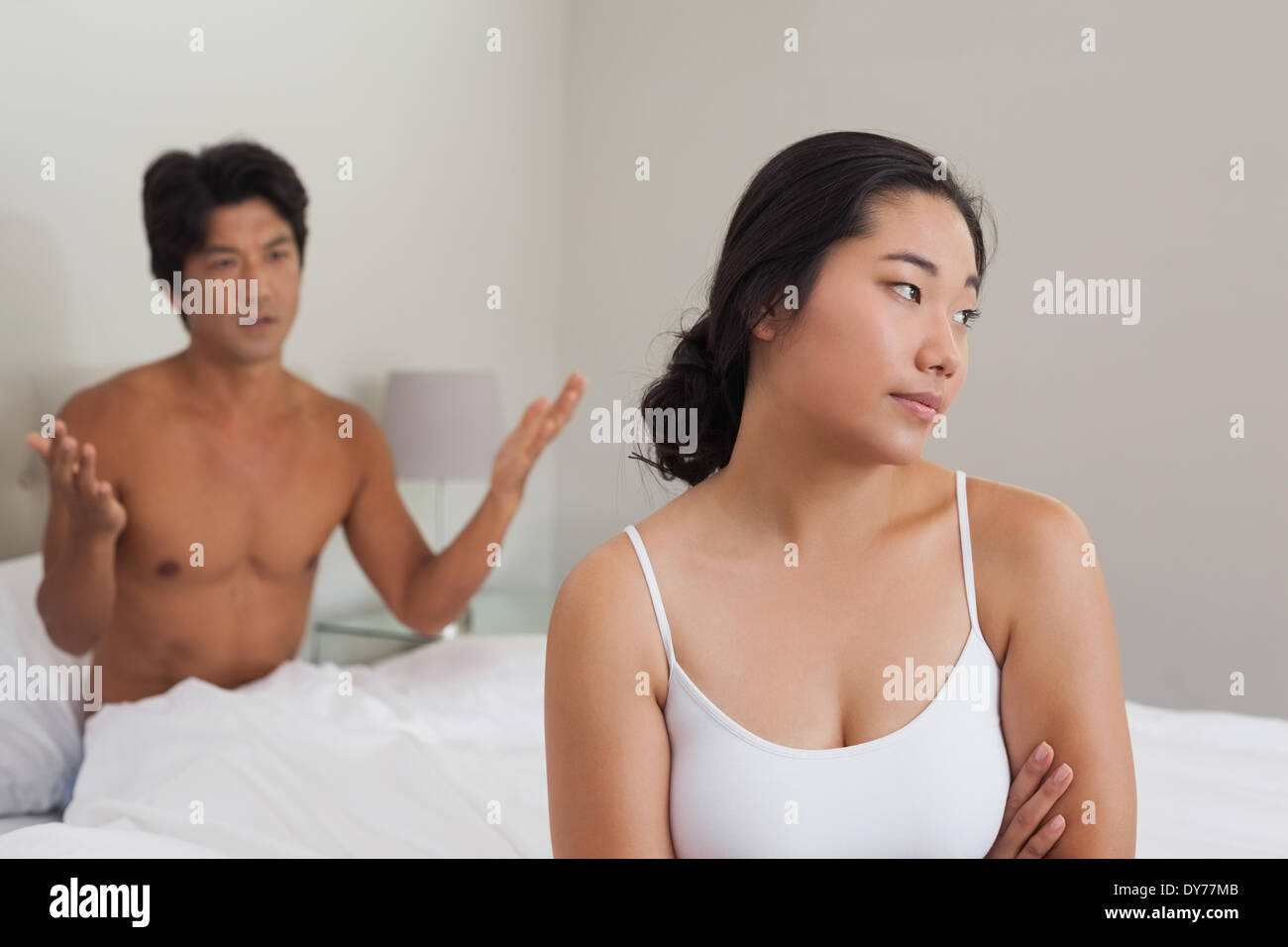 Couple having an argument in bed Banque D'Images