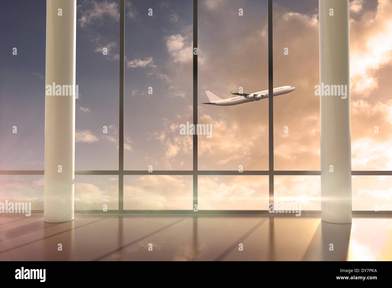 La fenêtre de vol d'un avion passé au lever du soleil Banque D'Images
