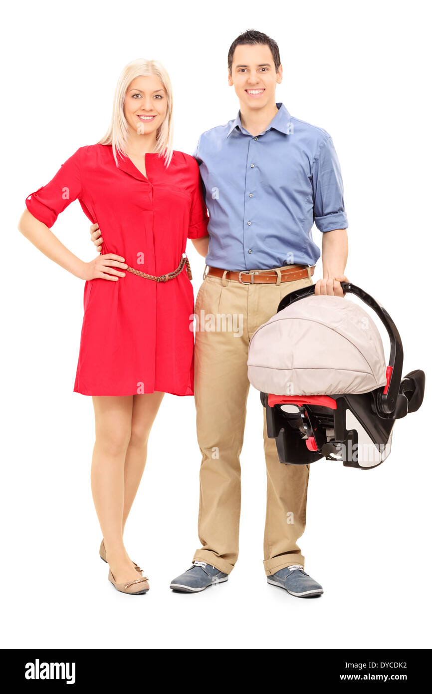 Les jeunes parents holding a baby stroller Banque D'Images