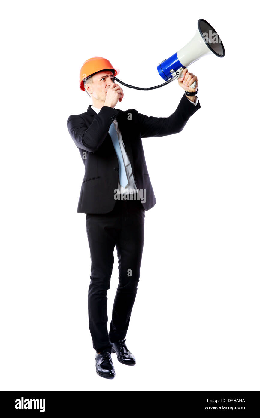 Portrait en pied d'un businessman shouting avec mégaphone sur fond blanc Banque D'Images