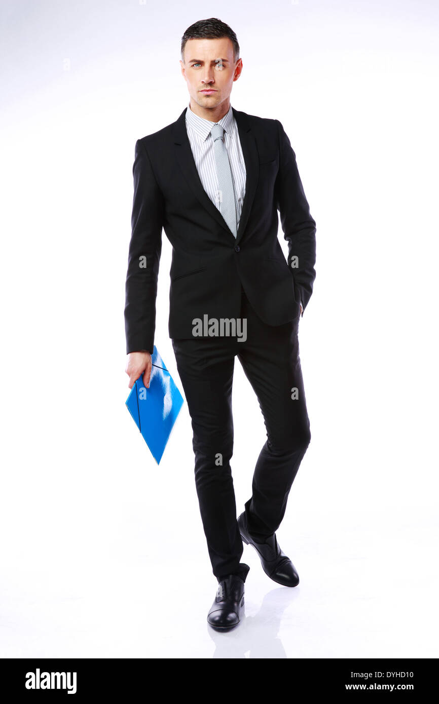 Studio shot of a businessman avec dossier bleu sur fond gris Banque D'Images
