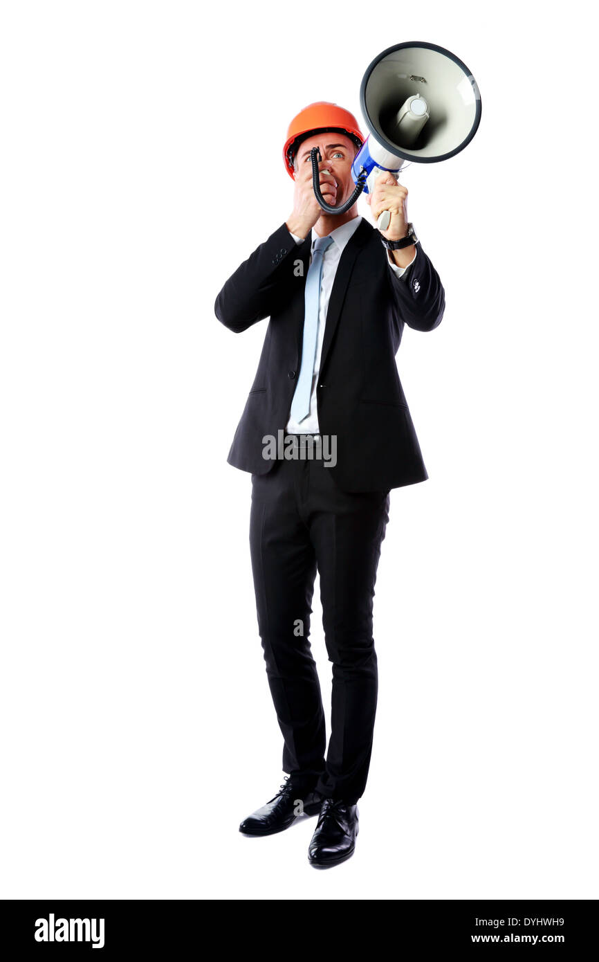 Portrait en pied d'un businessman shouting avec mégaphone sur fond blanc Banque D'Images