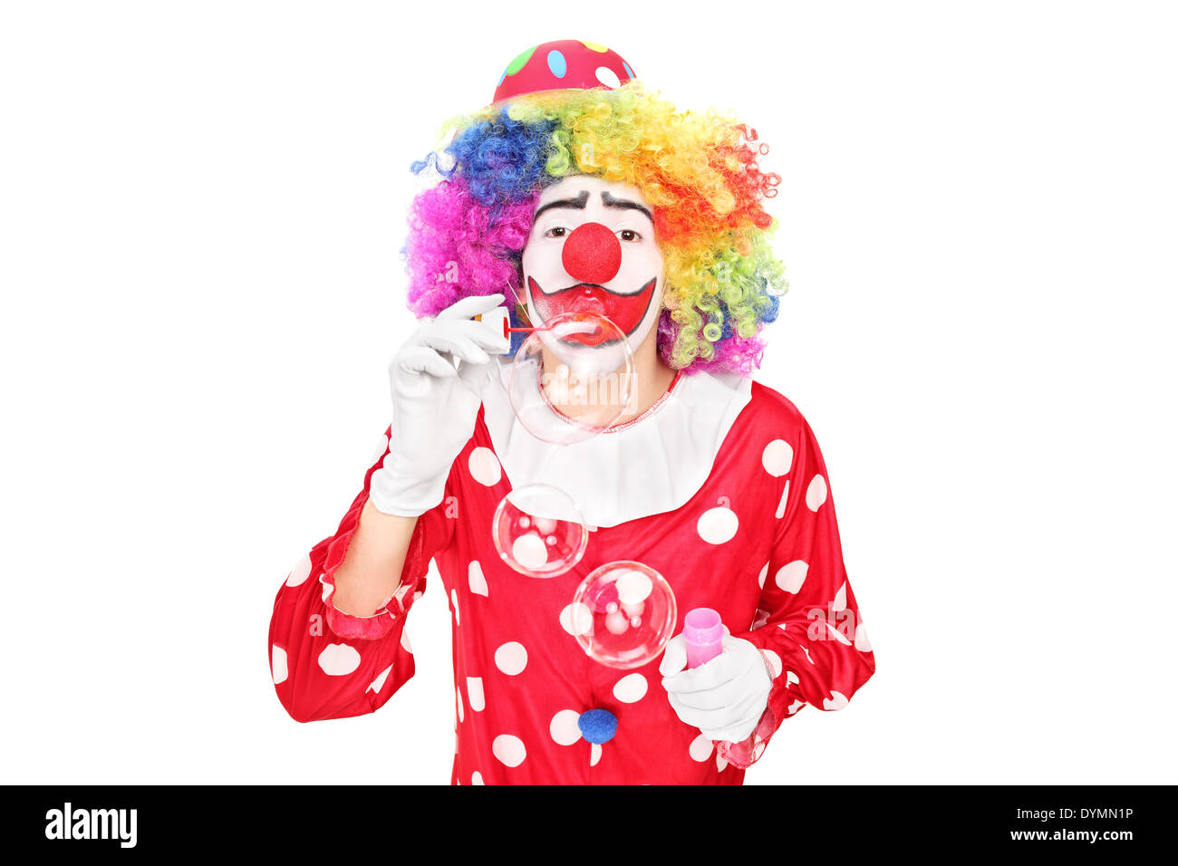 Funny clown blowing bubbles Banque D'Images