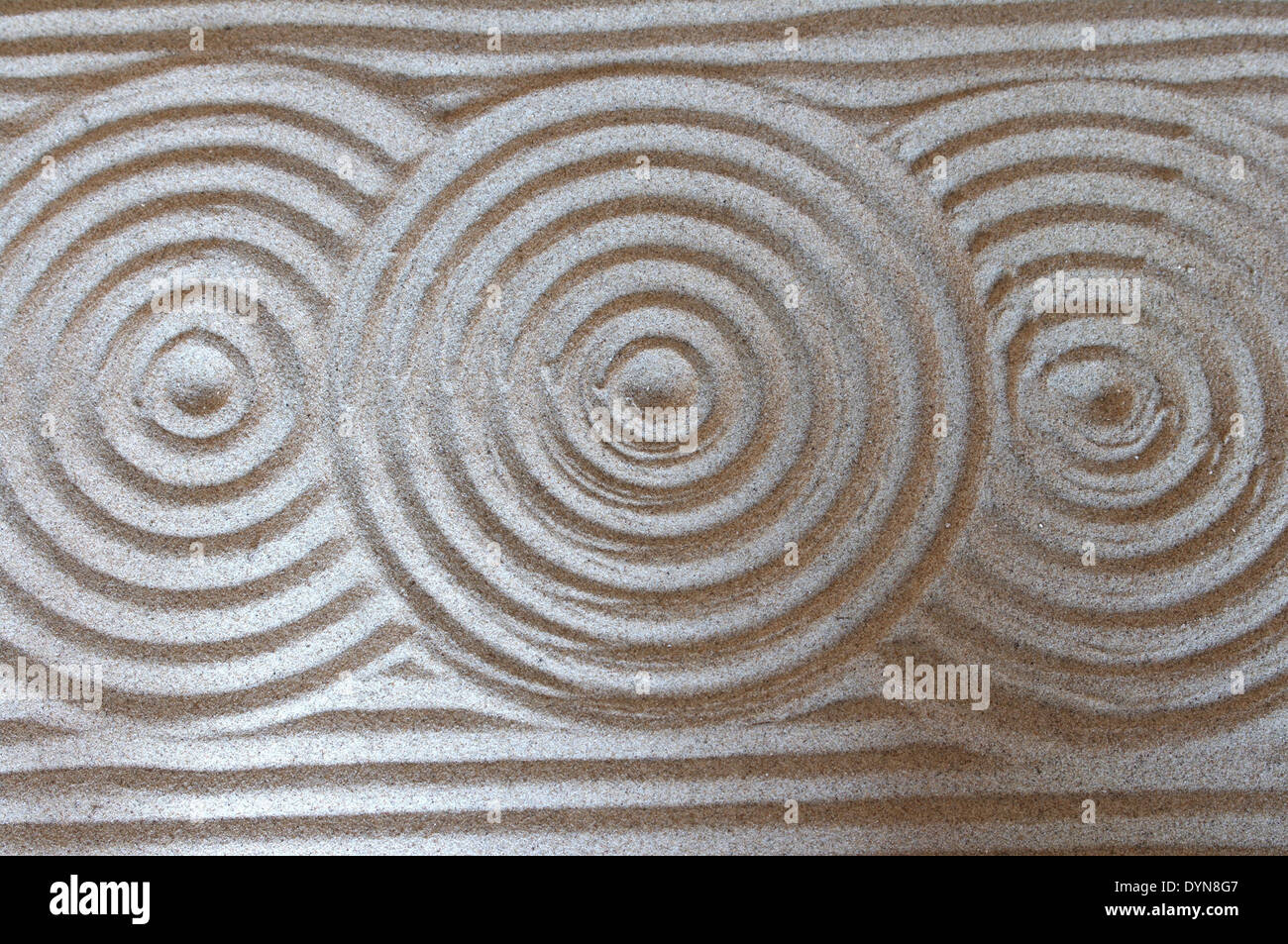 Arrière-plan avec des cercles sur le sable Banque D'Images