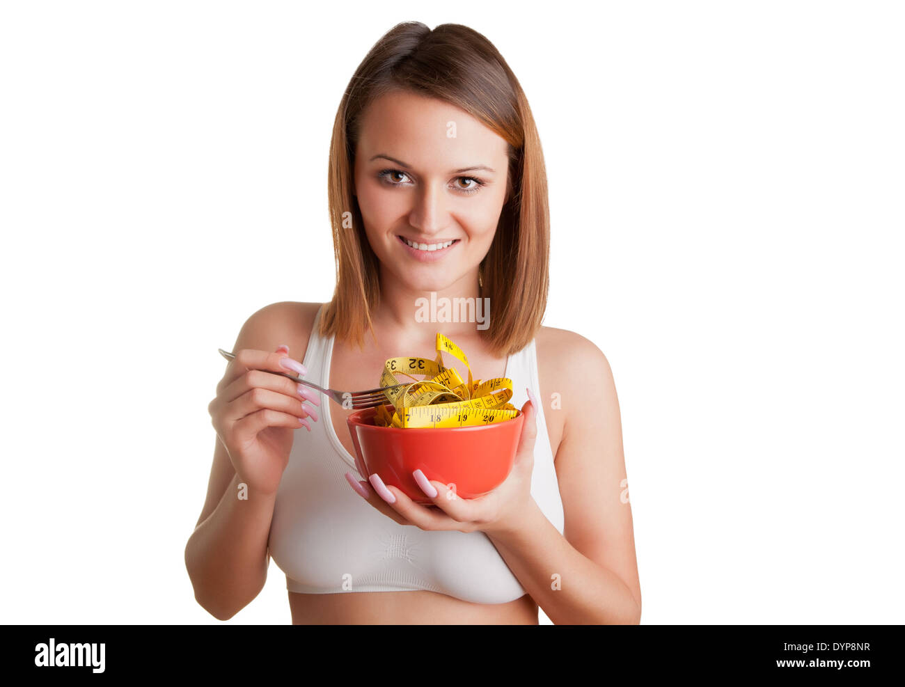 Notion de droit d'une femme sur un régime alimentaire, manger un ruban à mesurer, isolated on white Banque D'Images