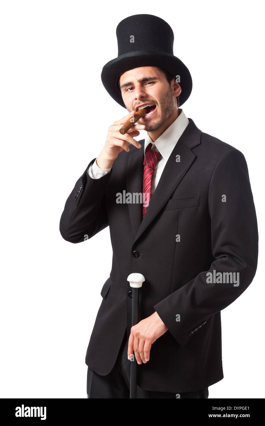 Un riche homme d'affaires avec un cigare, porter un grand chapeau et  portant un bâton de marche Photo Stock - Alamy
