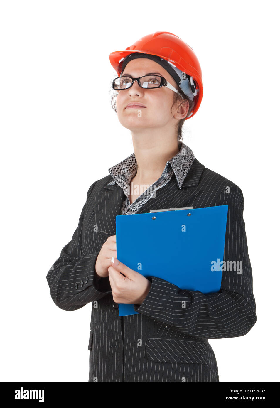 Femme dans le casque de construction et d'une tablette dans les mains de montres surface de bâtiment Banque D'Images