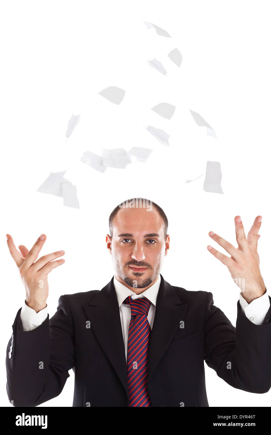 Un businessman déchirant quelques feuilles de papier Banque D'Images
