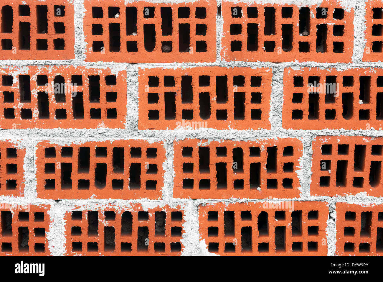 Arrière-plan de mur de briques rouges avec du ciment Banque D'Images