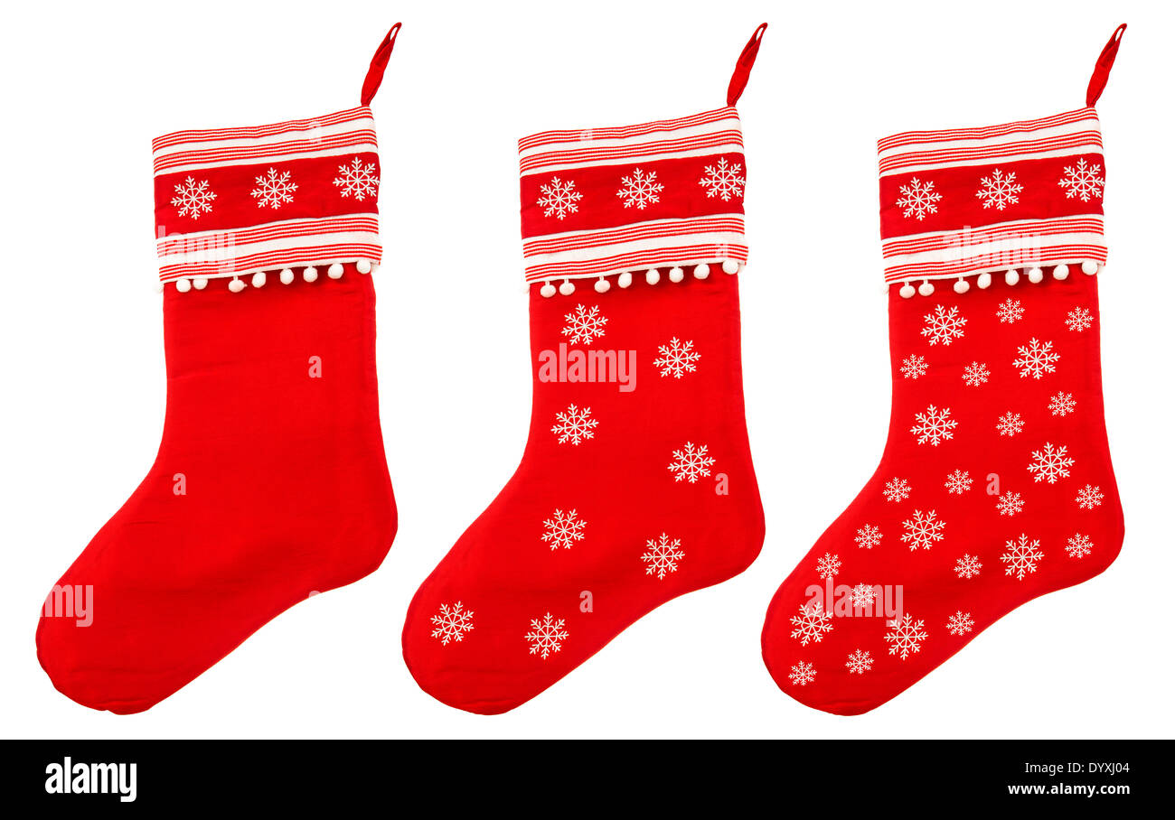 Chaussette de Noël rouge avec des flocons pour père noël sur fond blanc, symbole des vacances d'hiver. Banque D'Images