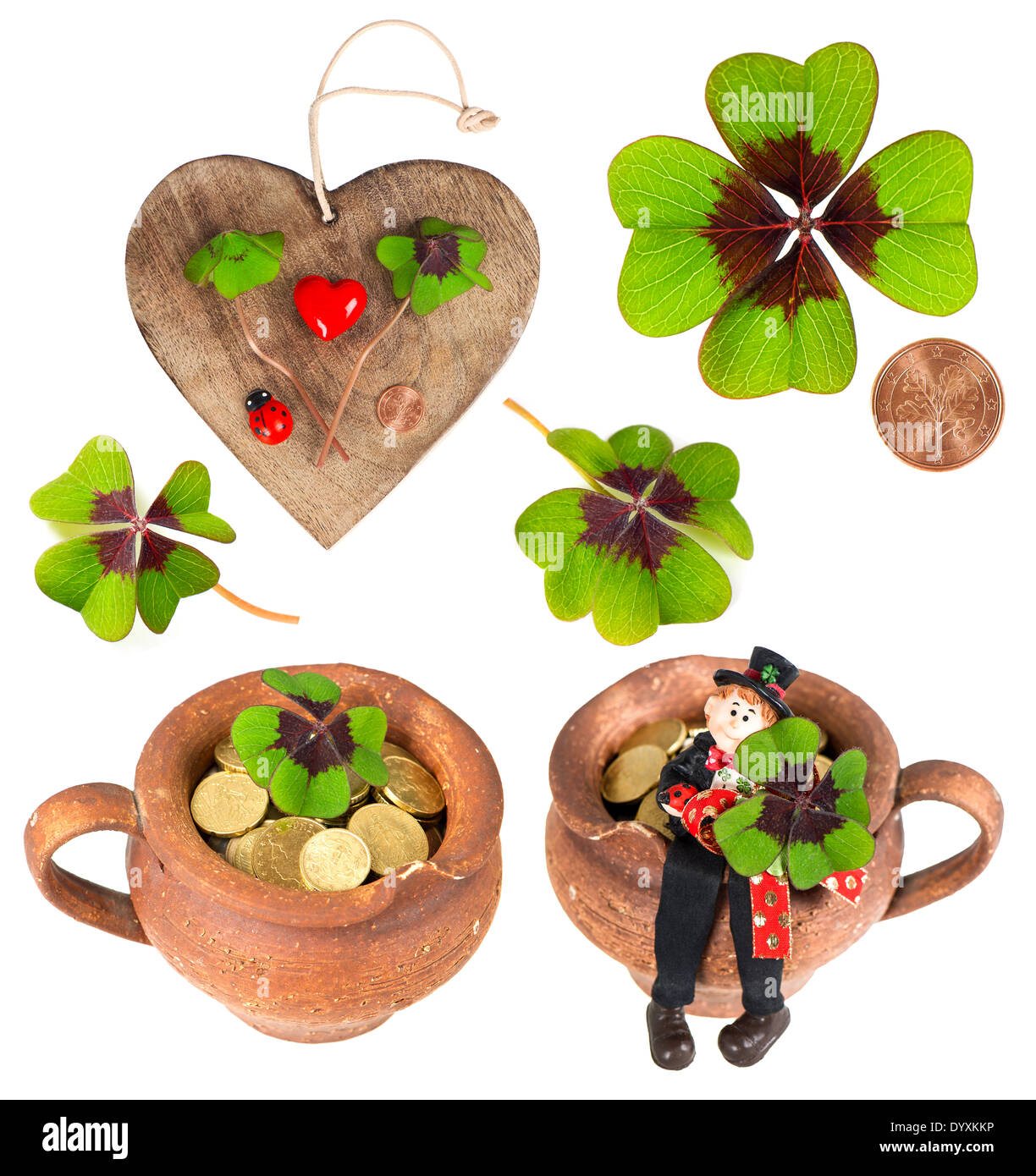 Coeur en bois avec des symboles de chance. cœur rouge, coins, trèfle, shamrock, ramoneur et coccinelle porte-bonheur. Banque D'Images