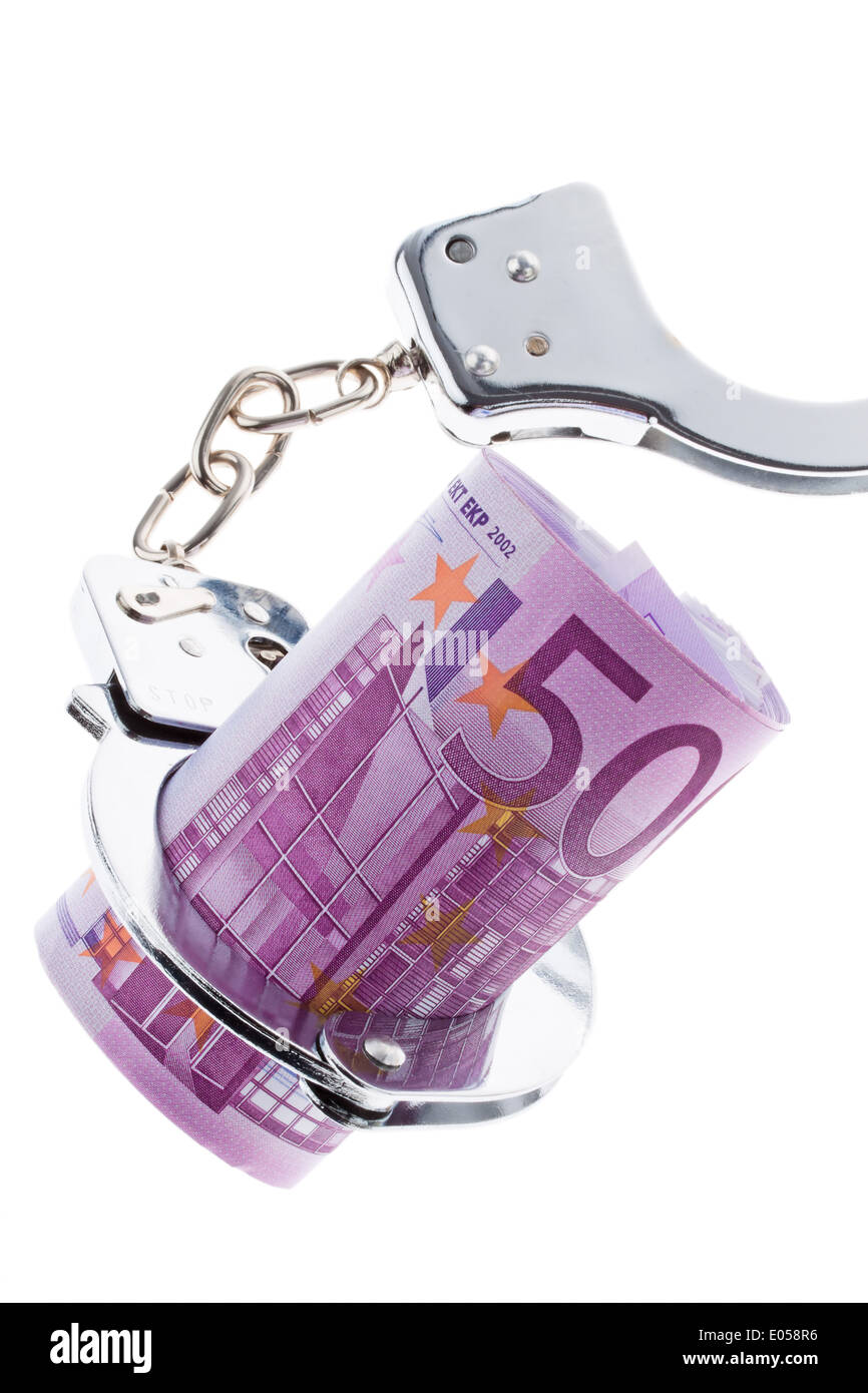 500 euros de billet de banque avec des menottes. L'activité criminelle dans l'économie, 500 Euro Geldschein mit Handschellen. Dans Kriminalitaet Banque D'Images