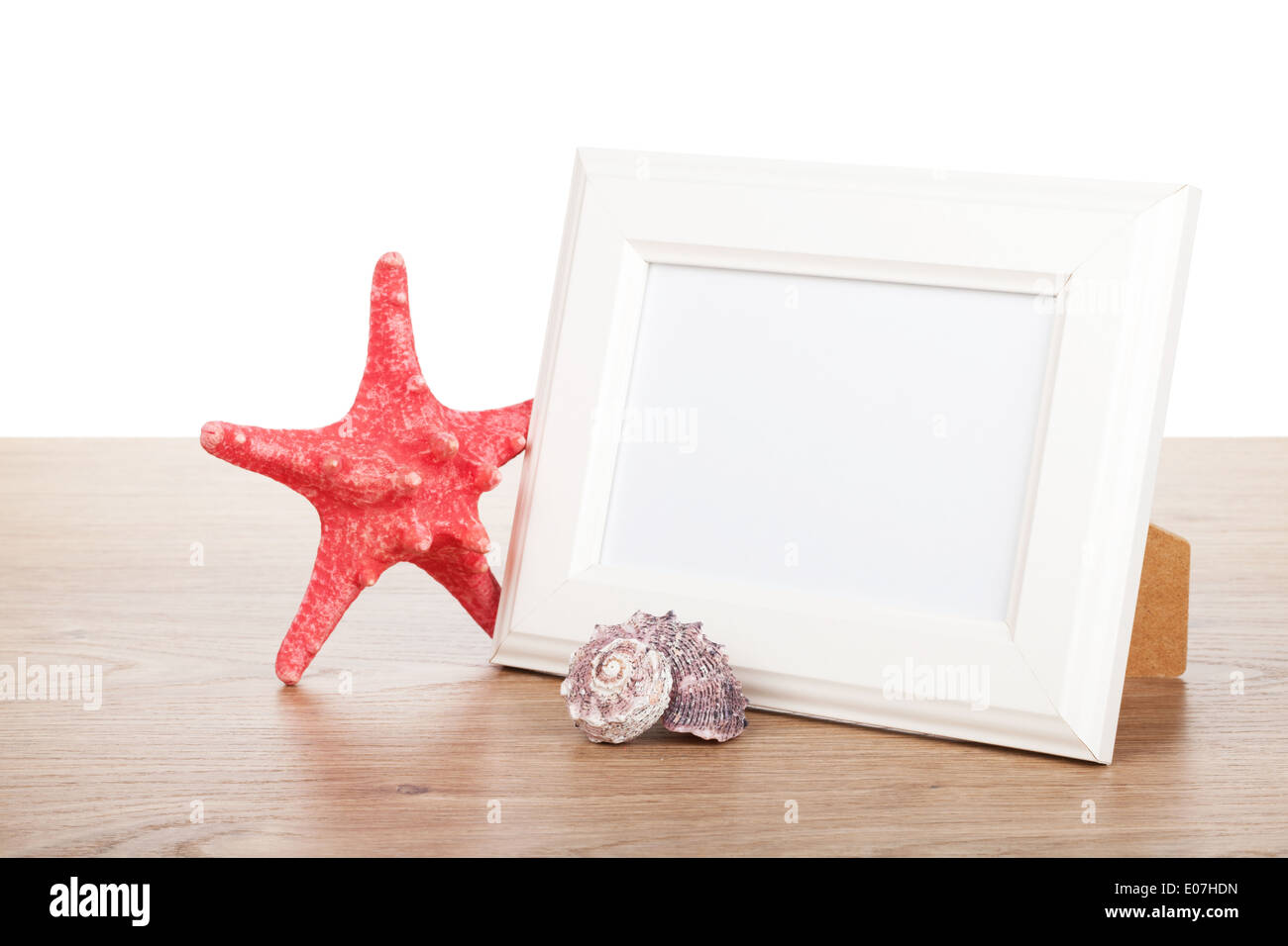 Cadre photo, starfish et seashell sur table en bois Banque D'Images