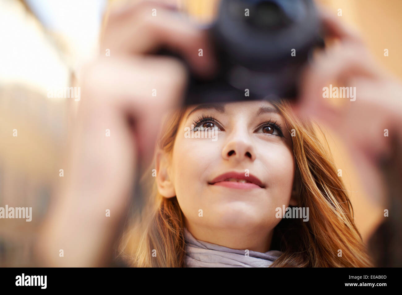 Close up of young woman photographing with digital camera Banque D'Images