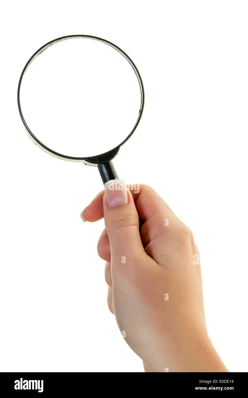 Une main est titulaire d'une loupe. Par la loupe ressemble., Eine Main haelt eine Lupe. Durch das Vergroesserungsglas betrac Banque D'Images