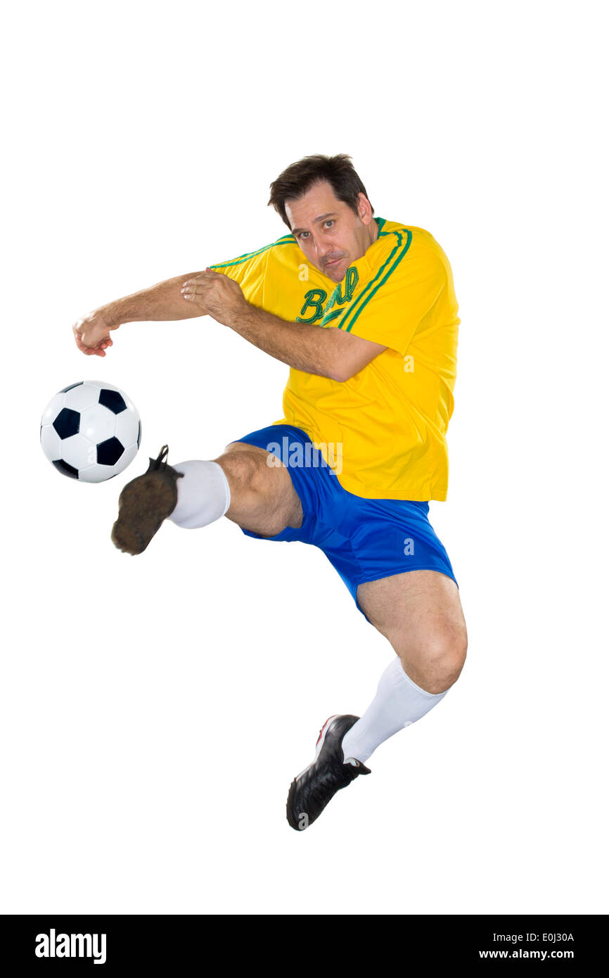 Joueur de football brésilien, sauter, jaune et bleu Banque D'Images