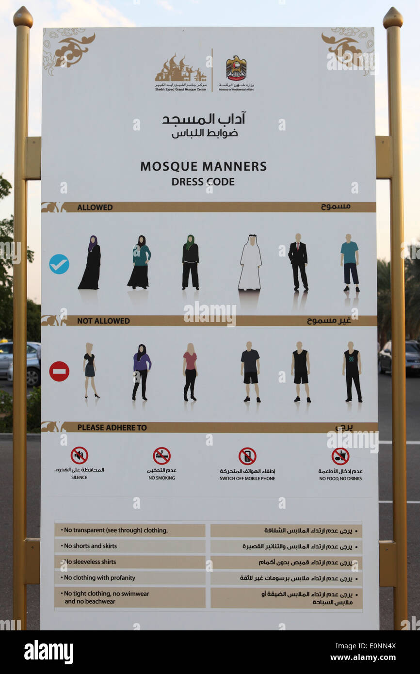 Panneau indiquant le code vestimentaire pour l'entrée dans la Grande Mosquée de Sheikh Zayed à Abu Dhabi. Banque D'Images
