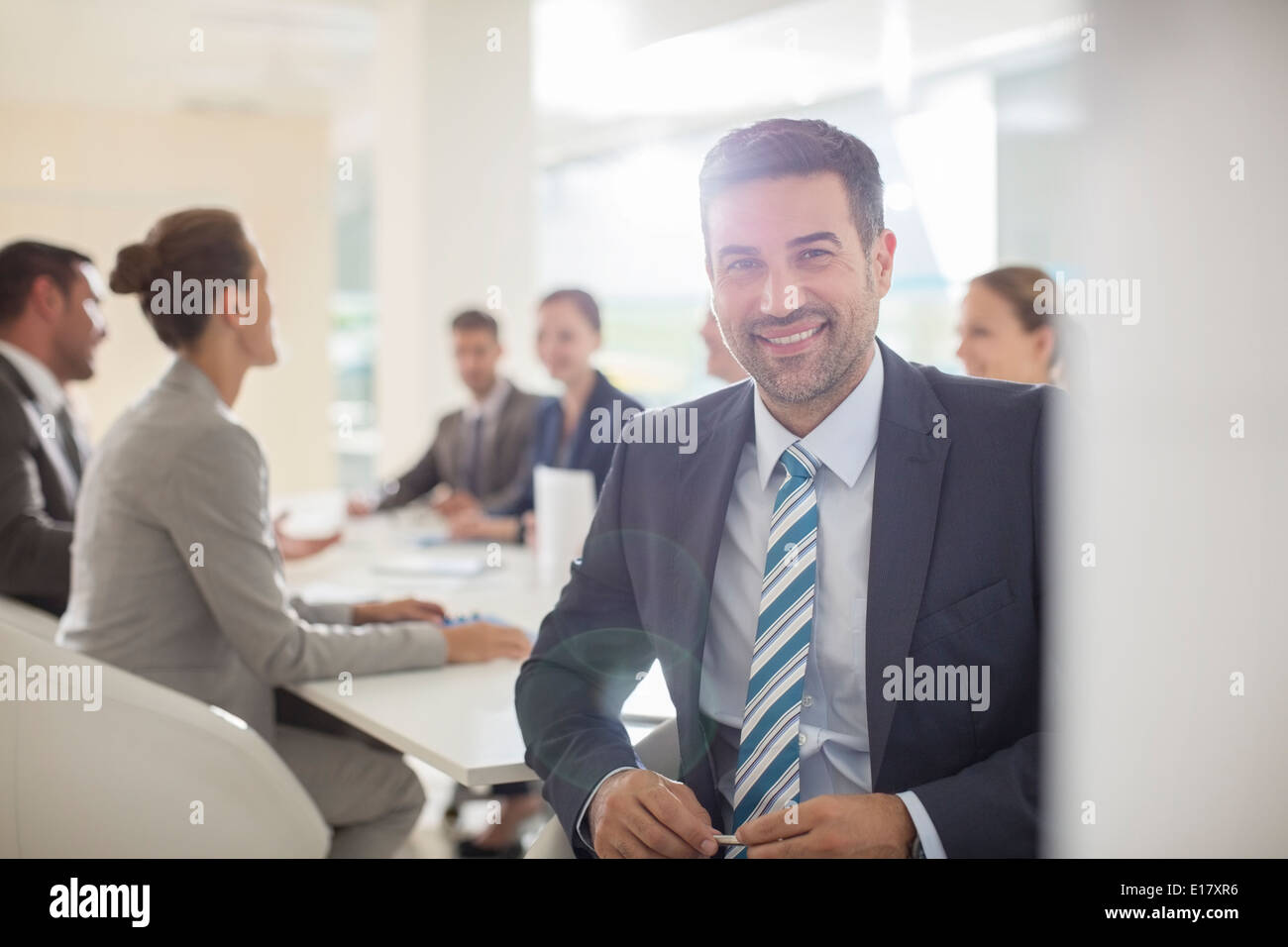 Portrait of smiling businessman in conference room Banque D'Images