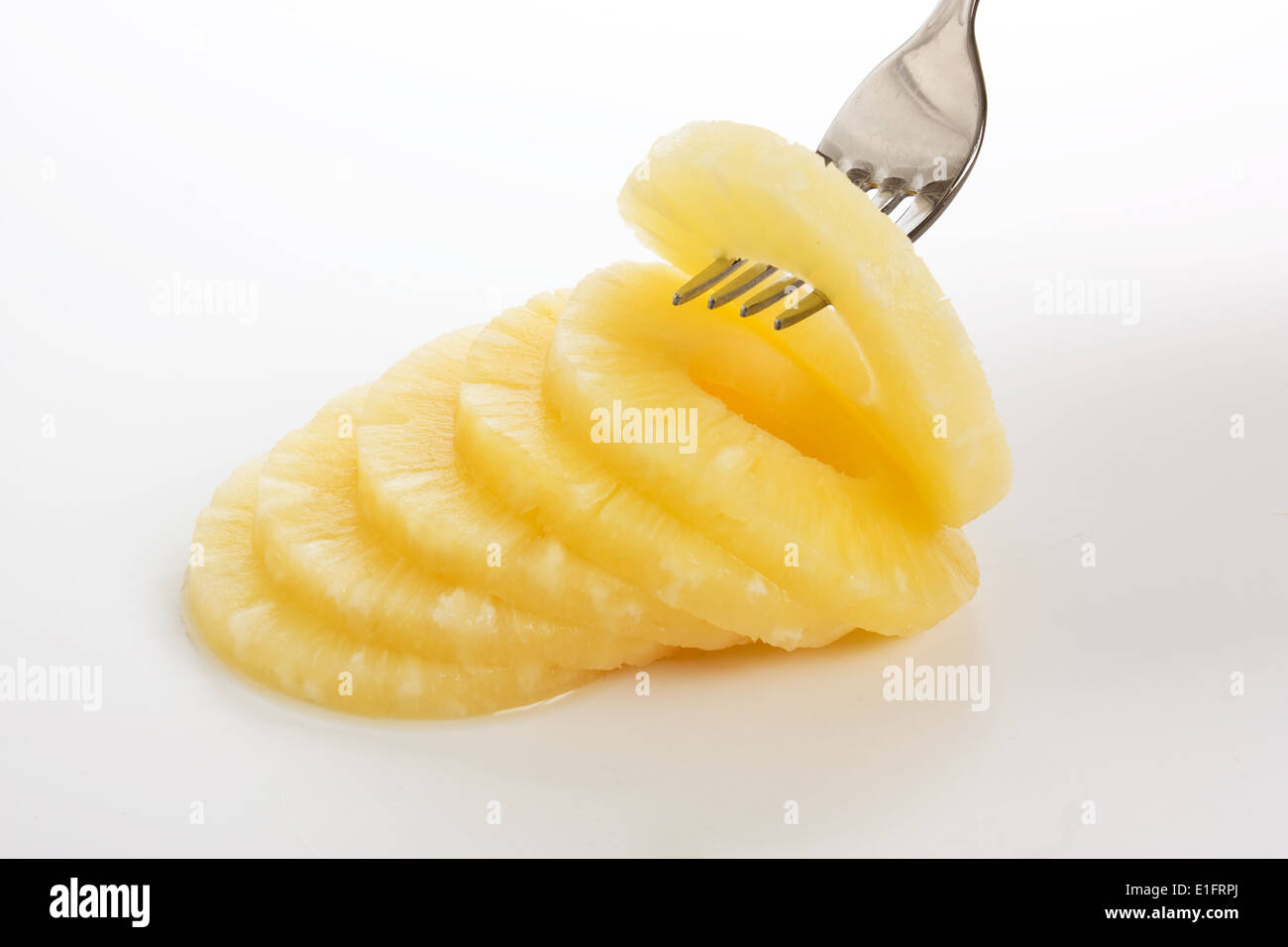 Tranche d'ananas sur une fourchette Banque D'Images