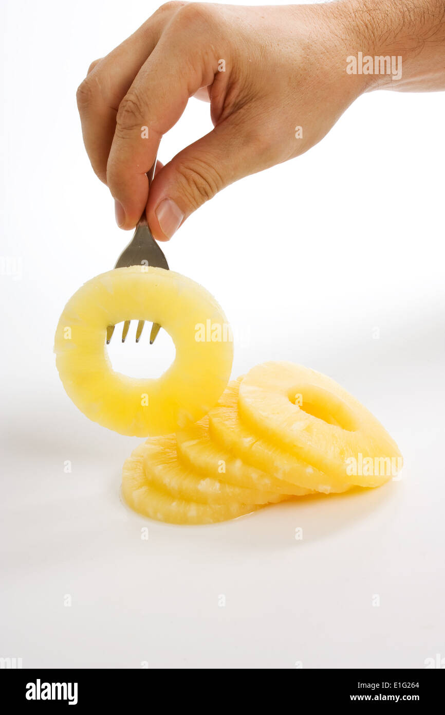Tranche d'ananas sur une fourchette Banque D'Images